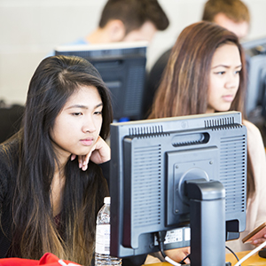 Teen girls learning to code