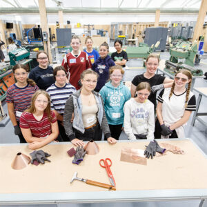 girls standing smiling at camera