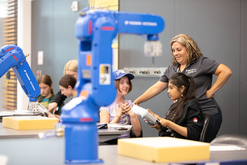 kids at a day camp working with machinery